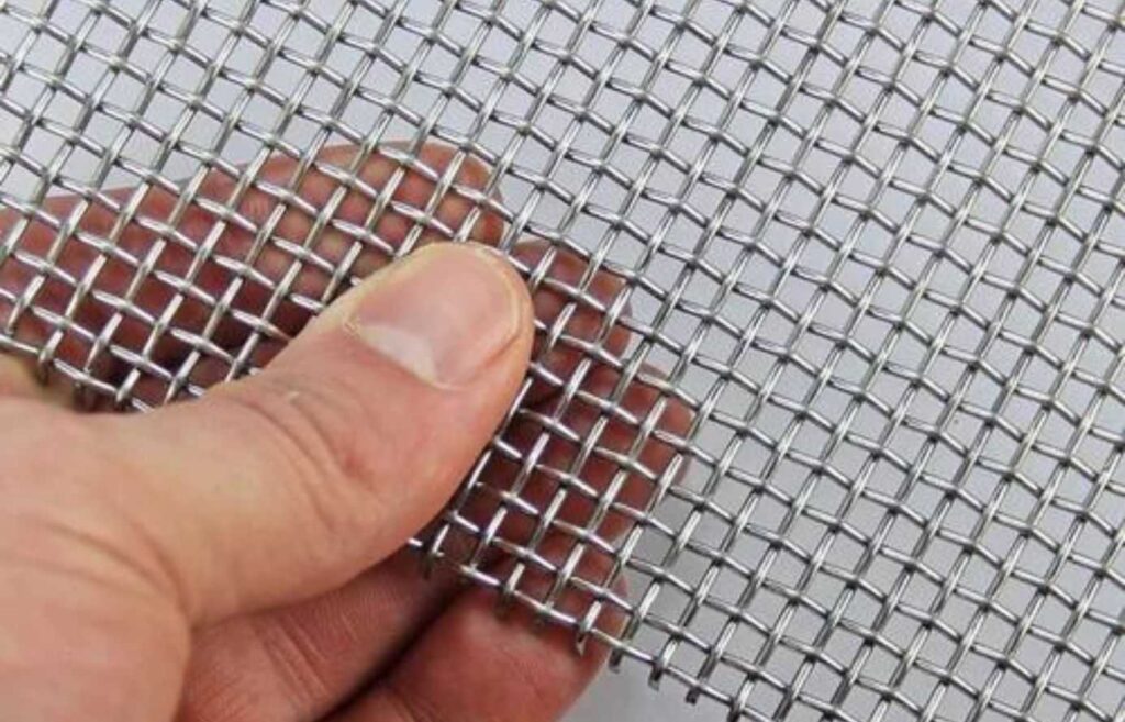 Close-up image of 14 gauge wire mesh with evenly spaced square openings.