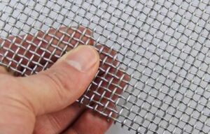 Close-up image of 14 gauge wire mesh with evenly spaced square openings.