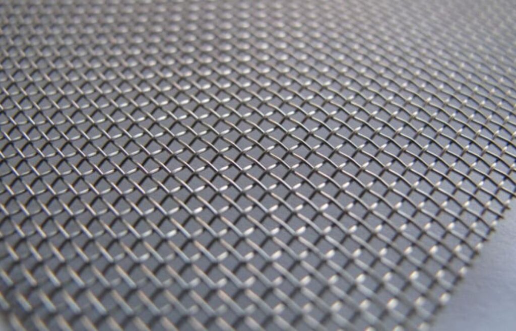 Close-up image of 14 gauge wire mesh with evenly spaced square openings.