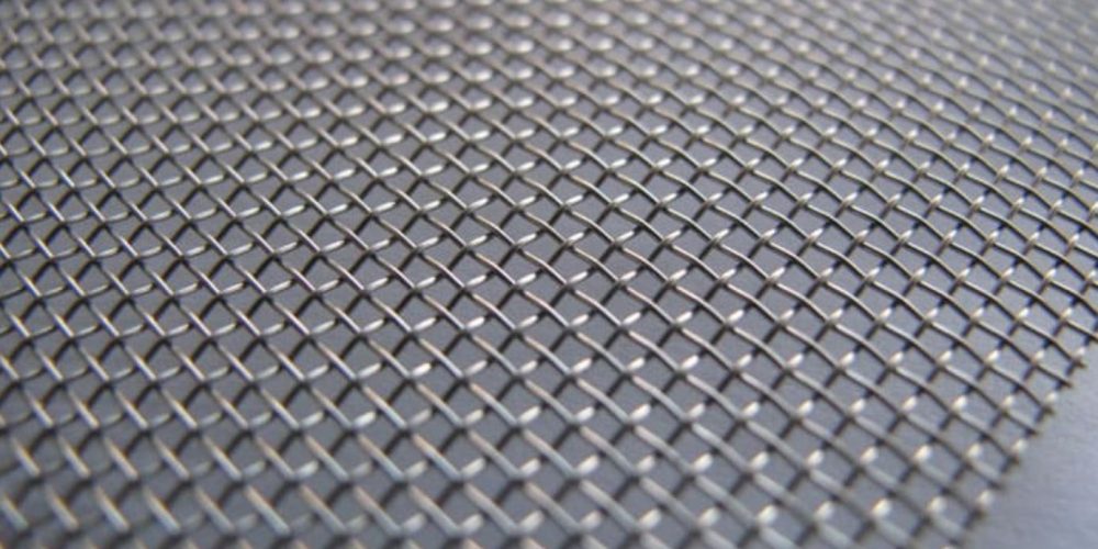 Close-up image of 14 gauge wire mesh with evenly spaced square openings.